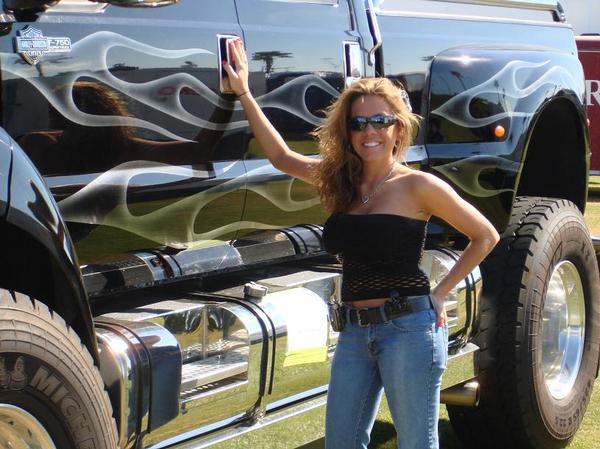Outrageous! Super hot girls in front of a big, bad ass Ford F650 Pickup