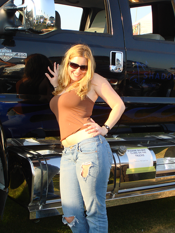 Hottie in front of a big Ford F650 F-series Truck
