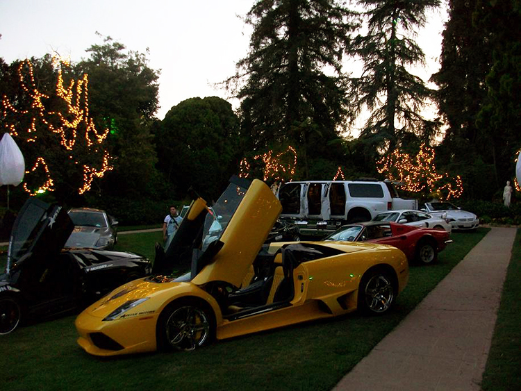 F650 chills with some bad ass cars outside the Playboy Mansion